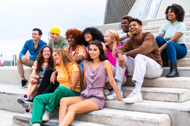 istock Happy playful multiethnic group of young friends bonding outdoors 1575902607