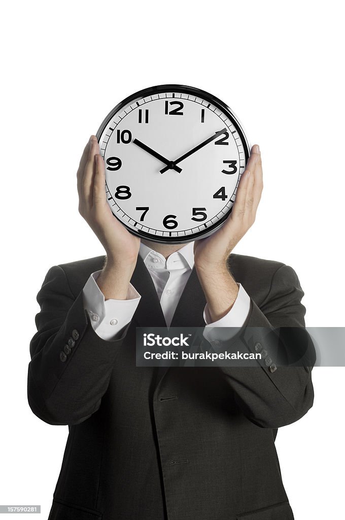 Empresário segurando um relógio na frente de seu rosto - Royalty-free Relógio Foto de stock