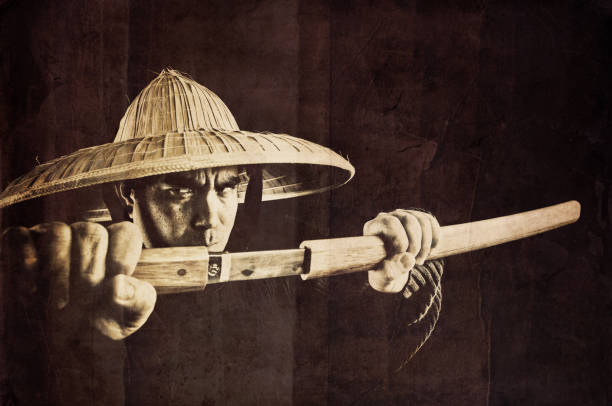 the return of the winter monk - mean looking fighter with a katana - overlay with grunge textures and chinese old paper