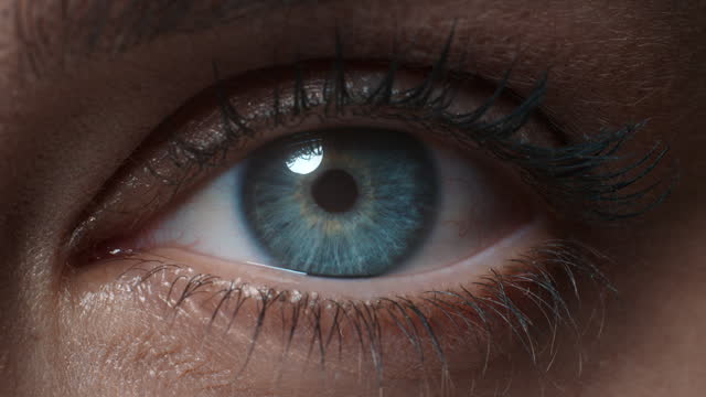 close up macro eye opening human iris beautiful blue eye healthy eyesight awareness concept
