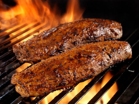 Appetizing meat grilled on barbecue grill