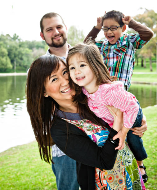 istock adorable family at the park 157590786