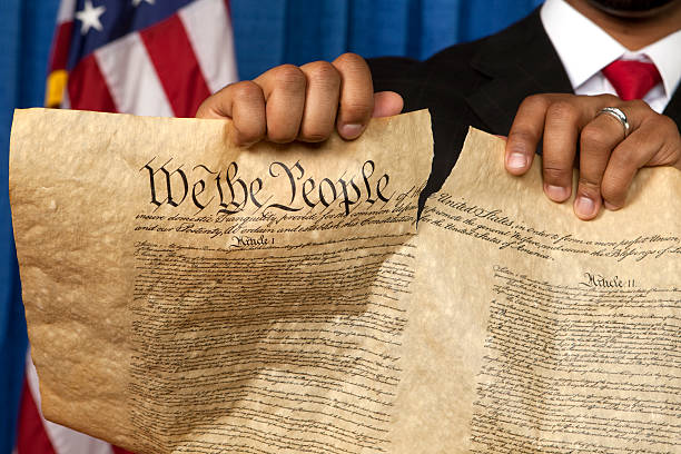 Destroying the Bill of Rights http://dieterspears.com/istock/links/button_election.jpg constitution ripped stock pictures, royalty-free photos & images