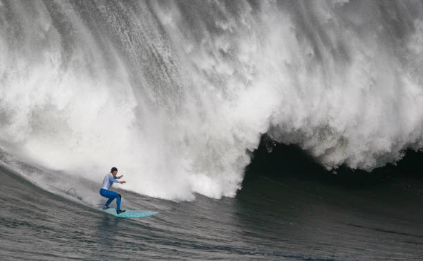 istock Surfing the curl of a huge wave 157591872