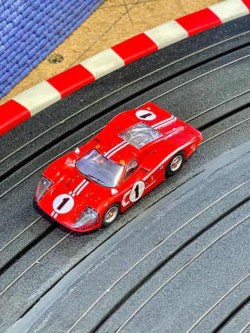 Electric slot car closeup on the race track