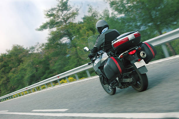istock Motorbiker driving on highway in Fethiye, Turkey 157592078