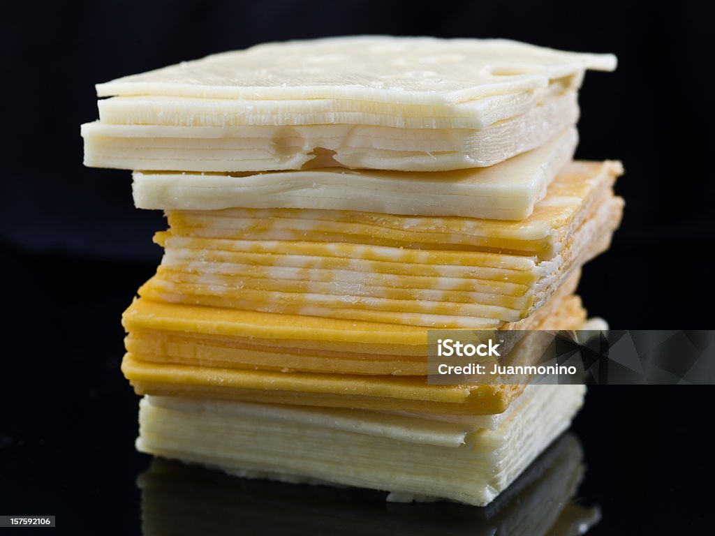 Quattro formaggi a fette - Foto stock royalty-free di Formaggio