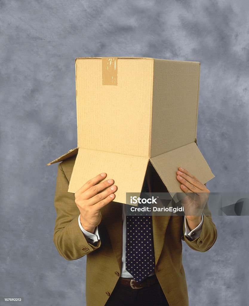 Człowiek z pudełka na głowie - Zbiór zdjęć royalty-free (Biznes)