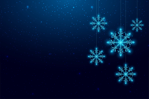 Hanging wireframe snowflakes in low poly style. Christmas and New Year concept. Abstract modern vector illustration isolated on blue background.