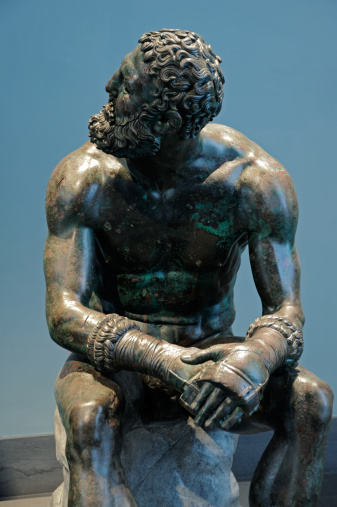 Italy, Rome (Museo Nazionale Romano): Resting Boxer  1st century BCE Roman copy of 3rd century Greek original by Apollonius Bronze.