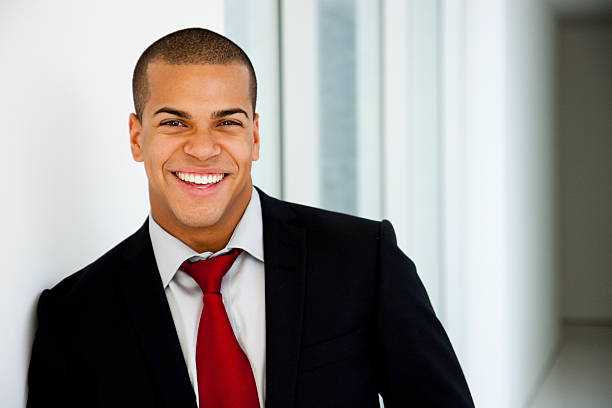 istock Smiling young businessman in jacket and red tie 157592396