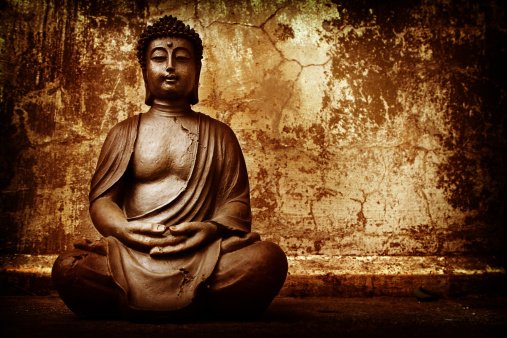 Buddha against grunge background.