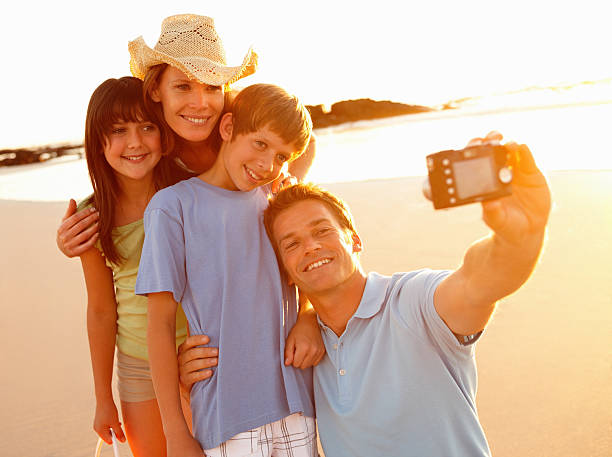 istock Happy family taking self portrait at beach 157592541