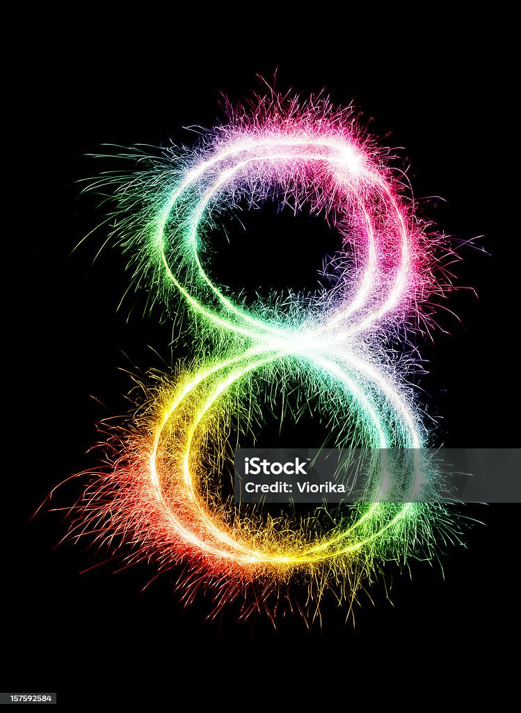 A sparkler forming the number 8 in a rainbow color Sparkling multi colored number 8 on a pure black background. Can be used for birthdays, anniversaries. Number 8 Stock Photo