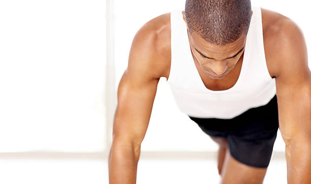 istock Healthy young man exercising against white 157592683