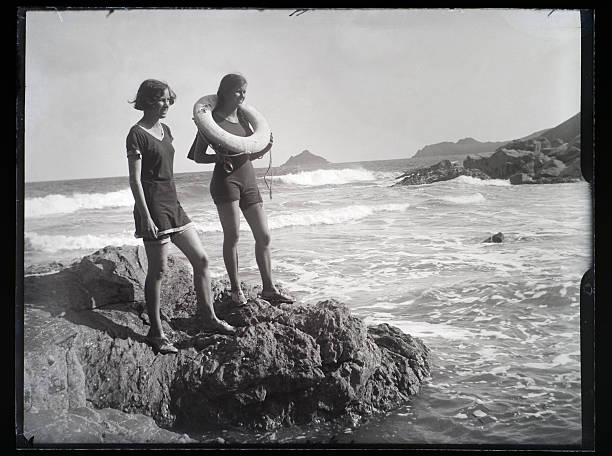 Girls at the Seaside - Vintage Photograph  black and white beach stock pictures, royalty-free photos & images