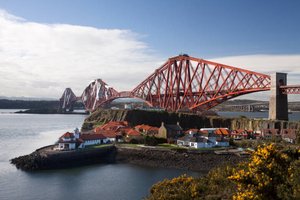 The Forth Bridge, AKA  Firth of Forth Rail Bridge, the famous rail crossing constructed to a cantilever  design opened in 1890, is a potential cultural UNESCO world heritage site. Located 14 km west of Edinburgh, its three diamond shaped towers carry a dual railway line 46 m above the water over a distance of 2.5 km between South Queensferry and North Queensferry.