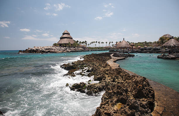 A scenic view of Xcaret with rocks and ocean Xcaret is a famous and typical Caribbean Sea waterpark, the water is crystal clear, near playa del carmen, in Mexico cozumel photos stock pictures, royalty-free photos & images