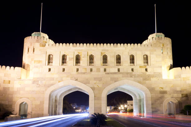 istock City Gate Masqat with Car Light Trails at Night Oman 157593595