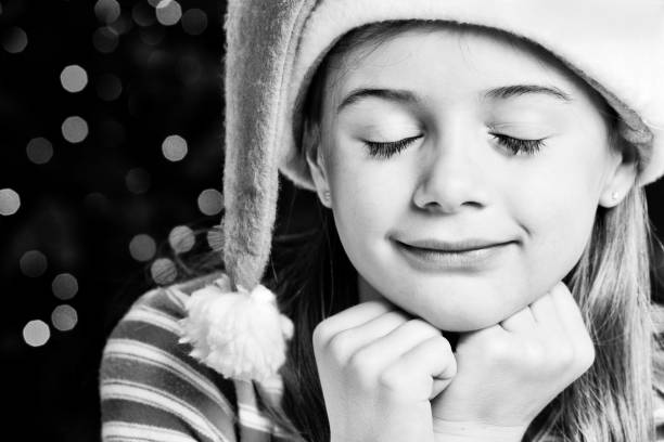 Adorable little girl dreams about the magic of Christmas.