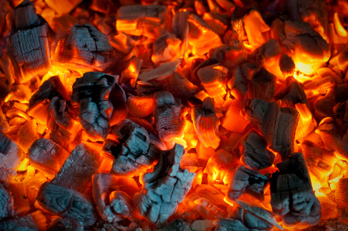 Hot coals in a wood burning stove.