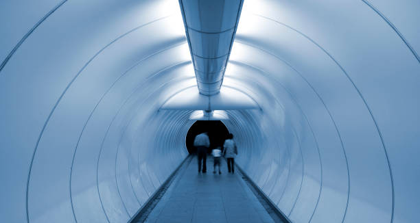 istock Family of three going through an underpass tunnel 157593933