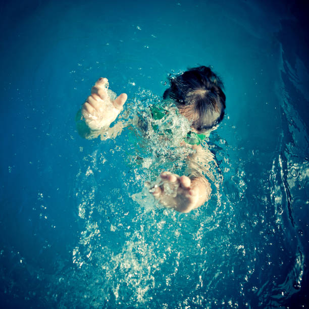 istock kid having a good time in the pool 157594017
