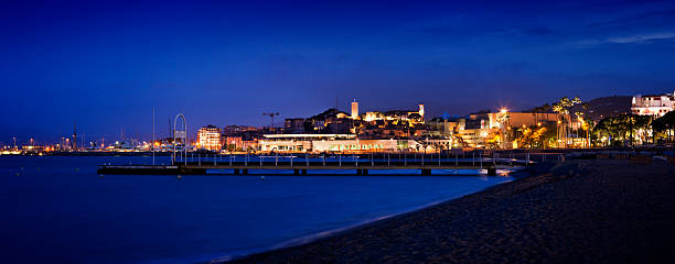 istock Panorama of Cannes with marine by night 157594042