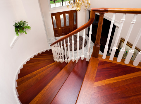 Interior and elegant solid wood stairs in modern floor house with abstract background.