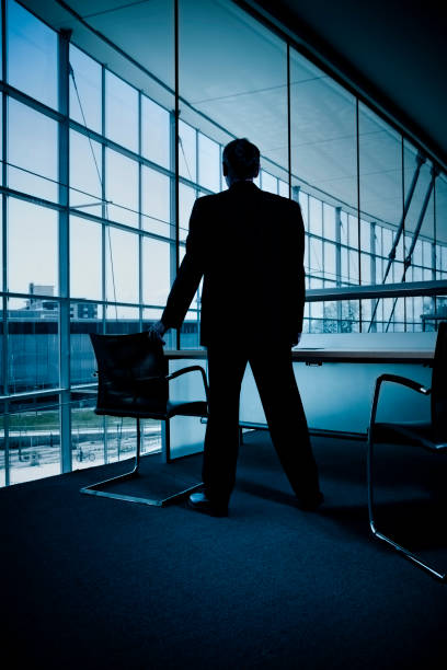 istock Businessman Looking Out Windows 157594263