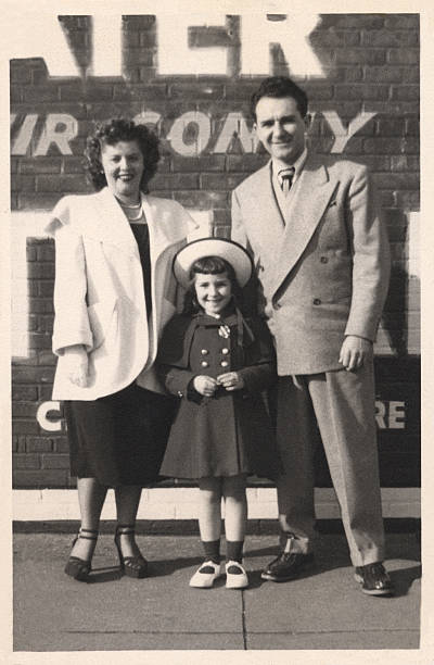 Vintage Family Snapshot Mom, dad, and daughter. Family portrait circa 1946,  Brooklyn, New York. 1940s style stock pictures, royalty-free photos & images