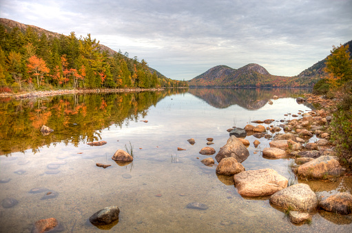 Acadia National Park preserves much of Mount Desert Island, and associated smaller islands, off the Atlantic coast of Maine. Photo taken during the peak autumn foliage season. Maine fall foliage ranks with the best in New England bringing out some of  the most beautiful foliage in the United States