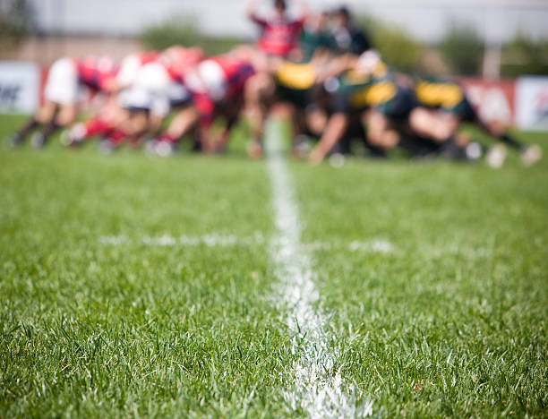 lawn in a field - rugby scrum stockfoto's en -beelden