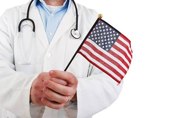 istock Doctor holding USA Flag 157594539