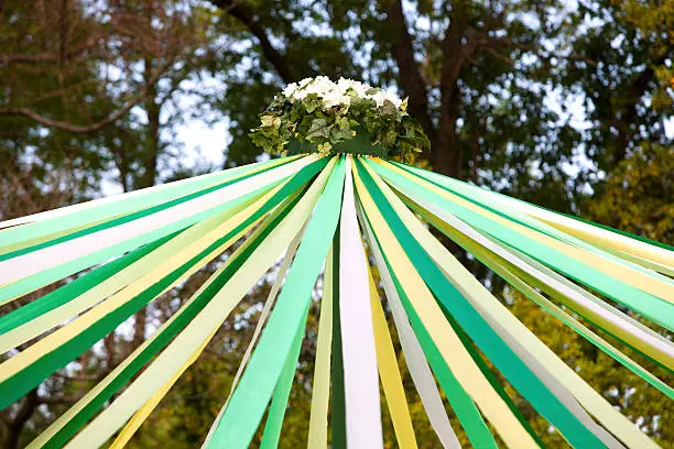 The top or upper half of a May pole used in celebration of May Day.