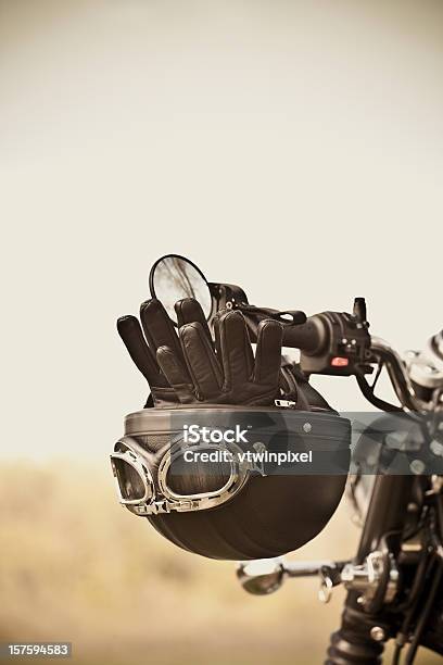 Vintage Helmet And Gloves On Motorcycle Stock Photo - Download Image Now - Motorcycle, Old-fashioned, Helmet