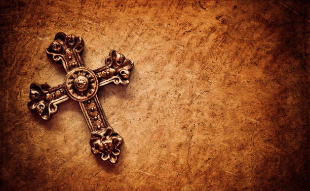 istock cross on brown paper background 157594658