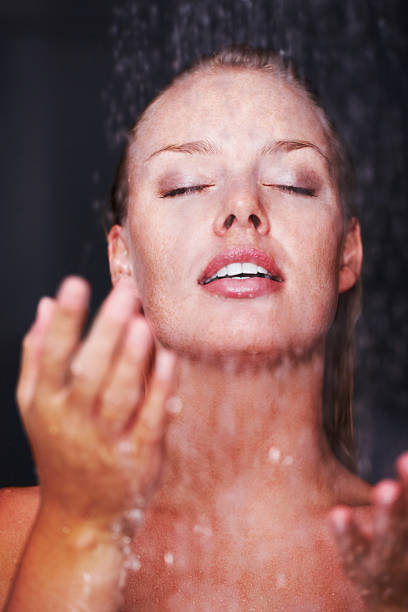 istock Sensuous Caucasian woman under a shower 157594693