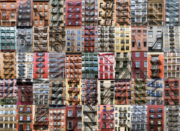 New York City vintage apartment building with windows and fire escapes in black and white