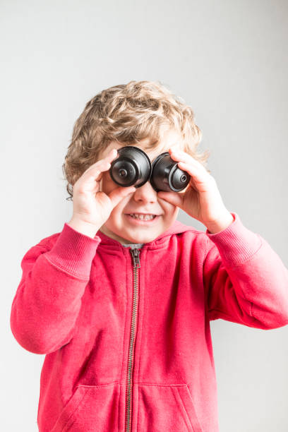 istock Child playing with coffee capsules 1575947329