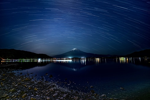 mount fuji and its reflection in Kawaguchiko under the stars