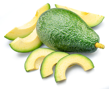 Avocado fruit with avocado slices isolated on white background.