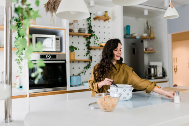istock Woman cooking at her kitchen 1575982476