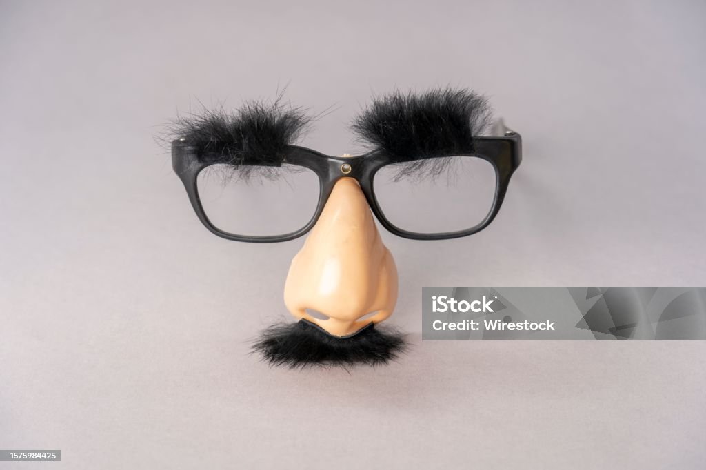 Black Pair Of Glasses With A Fake Nose And Black Fuzzy Mustache