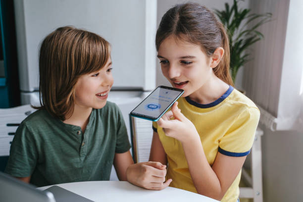 Children using system AI Chatbot in computer or mobile application. Chatbot conversation, Ai Artificial Intelligence technology. OpenAI generate. Futuristic technology. Virtual assistant on internet. stock photo