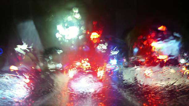 istock Fast Motion Dash Cam Night City Lights In Rain POV 1575988868