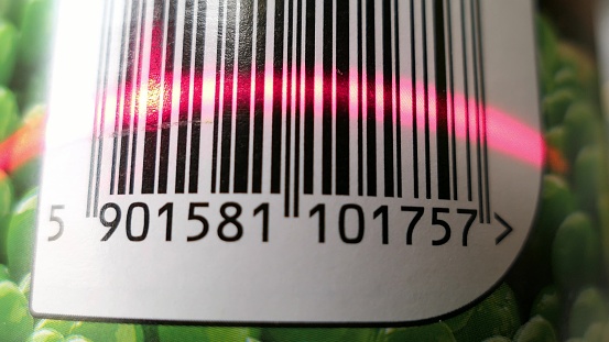 Scanning Barcode On Green Peas Can With Red Laser