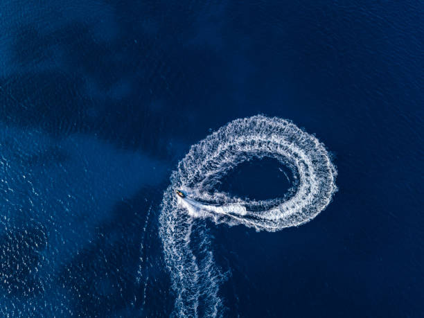 istock Aerial view on jetski in tropical blue waters 1576010510