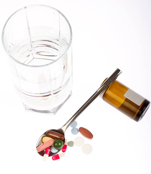 drugs, pills in different colours colors stock photo