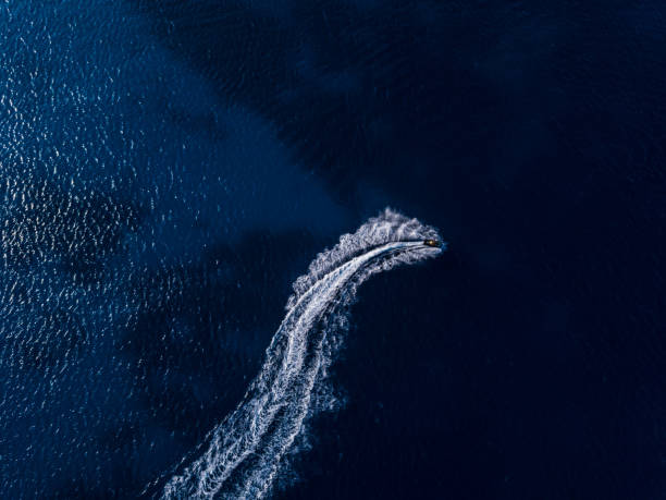 istock Aerial view on jetski in tropical blue waters 1576015975